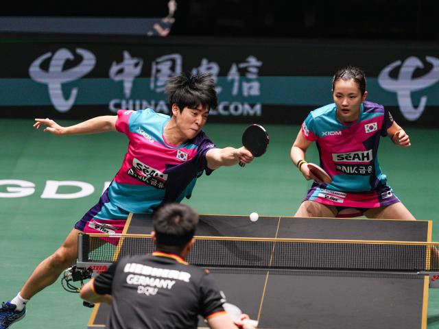 (251207) -- CHENGDU, Dec. 7, 2025 (Xinhua) -- Kim Nayeong/Park Ganghyeon (L) of South Korea compete in the mixed doubles match against Annett Kaufmann/Qiu Dang of Germany during the bronze medal match between South Korea and Germany at the ITTF Mixed Team World Cup 2025 in Chengdu, southwest China's Sichuan Province, Dec. 7, 2025. (Xinhua/Wang Xi)