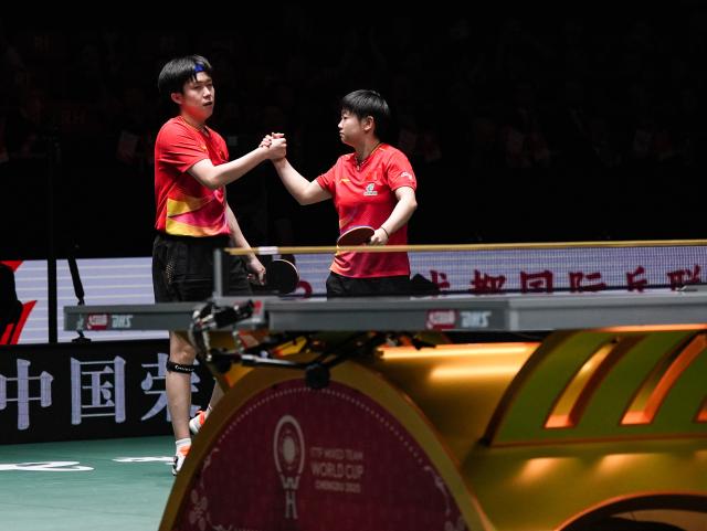 (251207) -- CHENGDU, Dec. 7, 2025 (Xinhua) -- Wang Chuqin/Sun Yingsha (R) of China celebrate in the mixed doubles match against Matsushima Sora/Odo Satsuki of Japan during the final match between China and Japan at the ITTF Mixed Team World Cup 2025 in Chengdu, southwest China's Sichuan Province, Dec. 7, 2025. (Xinhua/Wang Xi)