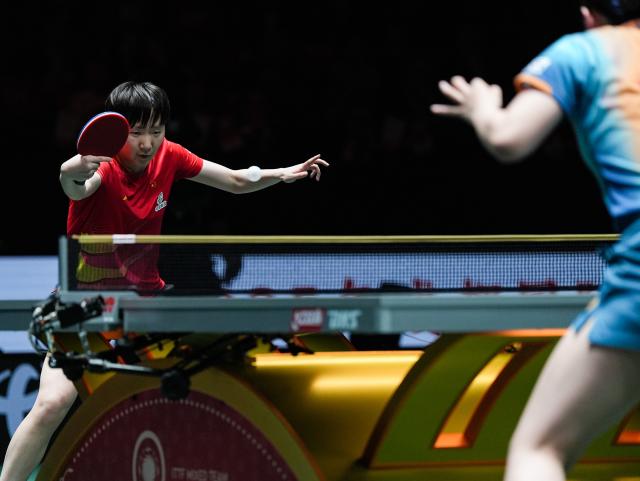 (251207) -- CHENGDU, Dec. 7, 2025 (Xinhua) -- Wang Manyu (L) of China competes in the women's singles match against Harimoto Miwa of Japan during the final match between China and Japan at the ITTF Mixed Team World Cup 2025 in Chengdu, southwest China's Sichuan Province, Dec. 7, 2025. (Xinhua/Wang Xi)