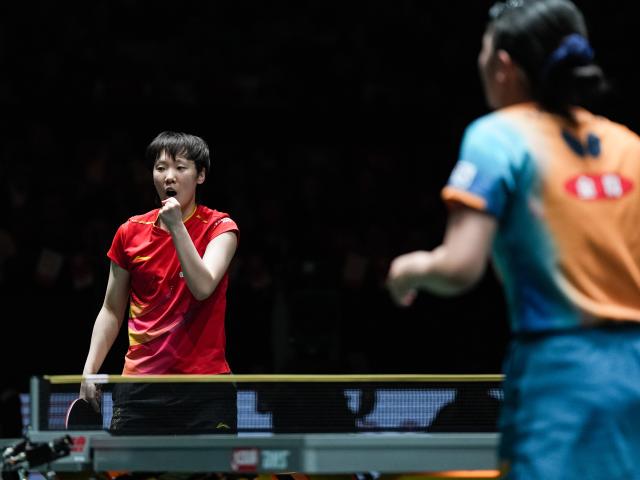 (251207) -- CHENGDU, Dec. 7, 2025 (Xinhua) -- Wang Manyu (L) of China reacts in the women's singles match against Harimoto Miwa of Japan during the final match between China and Japan at the ITTF Mixed Team World Cup 2025 in Chengdu, southwest China's Sichuan Province, Dec. 7, 2025. (Xinhua/Wang Xi)