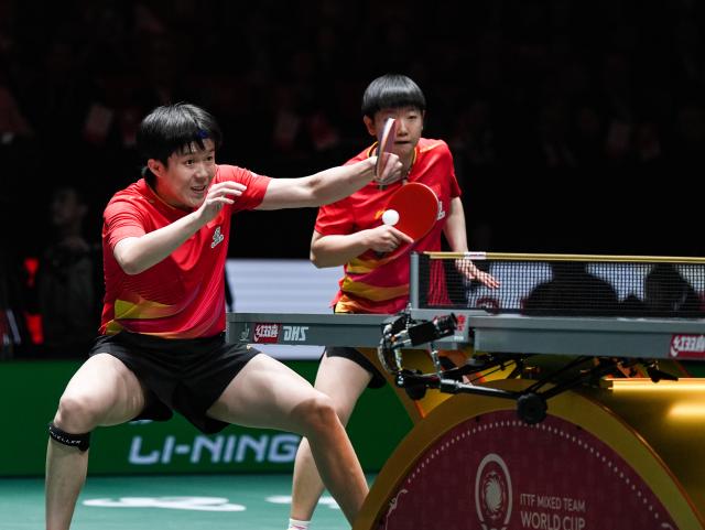 (251207) -- CHENGDU, Dec. 7, 2025 (Xinhua) -- Wang Chuqin (L)/Sun Yingsha of China compete in the mixed doubles match against Matsushima Sora/Odo Satsuki of Japan during the final match between China and Japan at the ITTF Mixed Team World Cup 2025 in Chengdu, southwest China's Sichuan Province, Dec. 7, 2025. (Xinhua/Wang Xi)