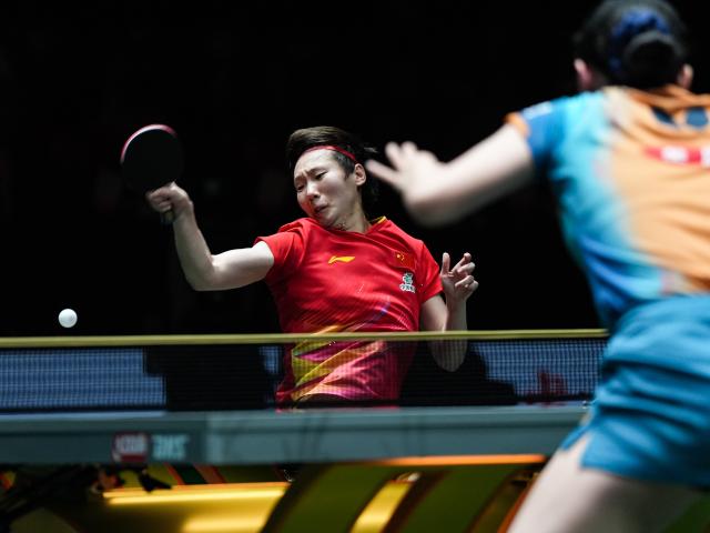 (251207) -- CHENGDU, Dec. 7, 2025 (Xinhua) -- Wang Manyu (L) of China competes in the women's singles match against Harimoto Miwa of Japan during the final match between China and Japan at the ITTF Mixed Team World Cup 2025 in Chengdu, southwest China's Sichuan Province, Dec. 7, 2025. (Xinhua/Wang Xi)