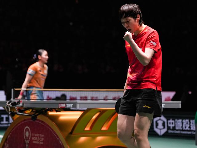 (251207) -- CHENGDU, Dec. 7, 2025 (Xinhua) -- Wang Manyu (R) of China reacts in the women's singles match against Harimoto Miwa of Japan during the final match between China and Japan at the ITTF Mixed Team World Cup 2025 in Chengdu, southwest China's Sichuan Province, Dec. 7, 2025. (Xinhua/Wang Xi)