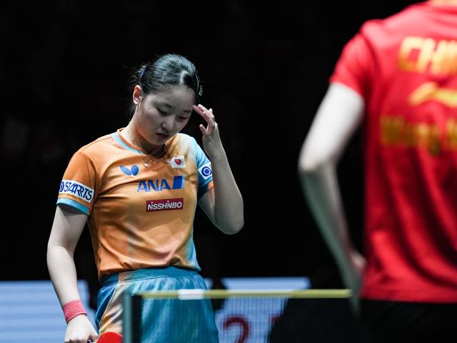 (251207) -- CHENGDU, Dec. 7, 2025 (Xinhua) -- Harimoto Miwa of Japan reacts in the women's singles match against Wang Manyu of China during the final match between China and Japan at the ITTF Mixed Team World Cup 2025 in Chengdu, southwest China's Sichuan Province, Dec. 7, 2025. (Xinhua/Wang Xi)