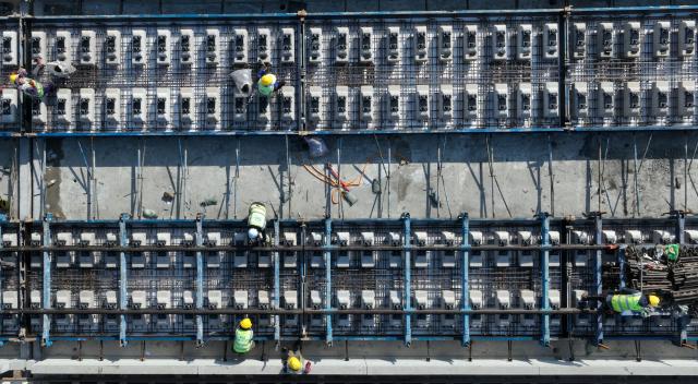 (251207) -- ZHAOTONG, Dec. 7, 2025 (Xinhua) -- An aerial drone photo taken on Dec. 7, 2025 shows a construction site of Chongqing-Kunming High-Speed Railway in Zhaotong, southwest China's Yunnan Province. (Photo by Zhang Guangyu/Xinhua)