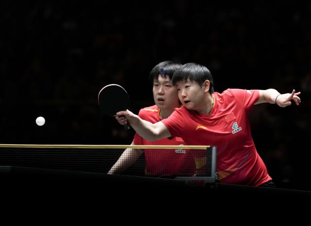 (251207) -- CHENGDU, Dec. 7, 2025 (Xinhua) -- Wang Chuqin/Sun Yingsha (R) of China compete in the mixed doubles match against Matsushima Sora/Odo Satsuki of Japan during the final match between China and Japan at the ITTF Mixed Team World Cup 2025 in Chengdu, southwest China's Sichuan Province, Dec. 7, 2025. (Xinhua/Wang Ying)