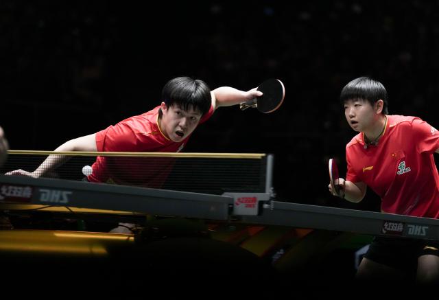 (251207) -- CHENGDU, Dec. 7, 2025 (Xinhua) -- Wang Chuqin (L)/Sun Yingsha of China compete in the mixed doubles match against Matsushima Sora/Odo Satsuki of Japan during the final match between China and Japan at the ITTF Mixed Team World Cup 2025 in Chengdu, southwest China's Sichuan Province, Dec. 7, 2025. (Xinhua/Wang Ying)