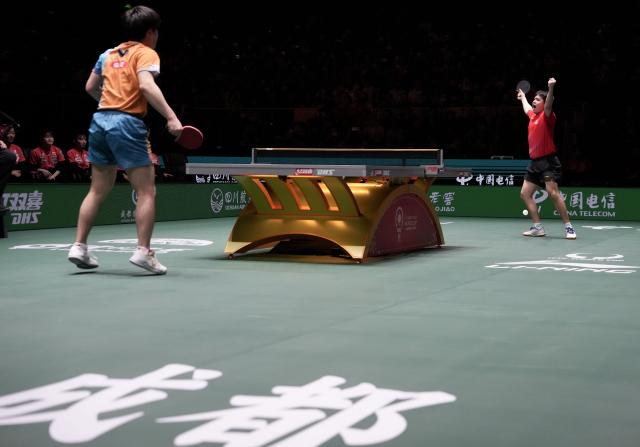 (251207) -- CHENGDU, Dec. 7, 2025 (Xinhua) -- Lin Shidong (R) of China reacts after the men's singles match against Harimoto Tomokazu of Japan during the final match between China and Japan at the ITTF Mixed Team World Cup 2025 in Chengdu, southwest China's Sichuan Province, Dec. 7, 2025. (Xinhua/Wang Ying)