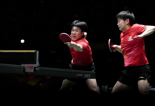(251207) -- CHENGDU, Dec. 7, 2025 (Xinhua) -- Wang Chuqin (L)/Sun Yingsha of China compete in the mixed doubles match against Matsushima Sora/Odo Satsuki of Japan during the final match between China and Japan at the ITTF Mixed Team World Cup 2025 in Chengdu, southwest China's Sichuan Province, Dec. 7, 2025. (Xinhua/Wang Ying)