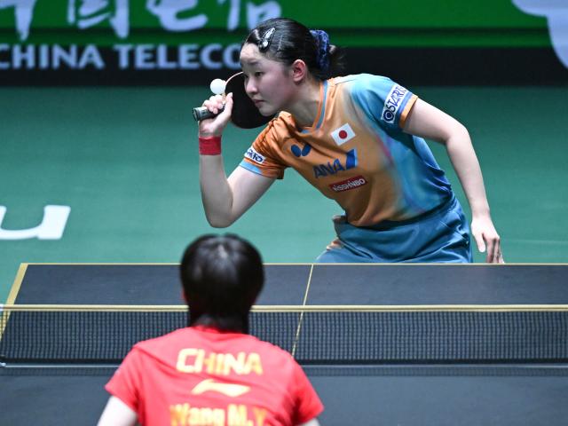 (251207) -- CHENGDU, Dec. 7, 2025 (Xinhua) -- Harimoto Miwa of Japan competes in the women's singles match against Wang Manyu of China during the final match between China and Japan at the ITTF Mixed Team World Cup 2025 in Chengdu, southwest China's Sichuan Province, Dec. 7, 2025. (Xinhua/Xu Bingjie)