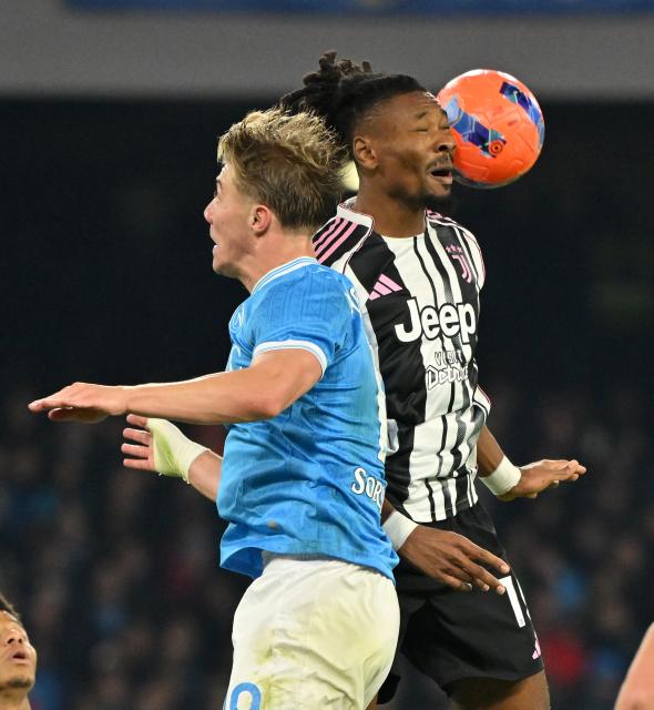 (251208) -- NAPLES, Dec. 8, 2025 (Xinhua) -- Napoli's Rasmus Hojlund (L) vies with Juventus' Khephren Thuram during a Serie A football match between Napoli and Juventus in Naples, Italy, Dec. 7, 2025. (Photo by Alberto Lingria/Xinhua)
