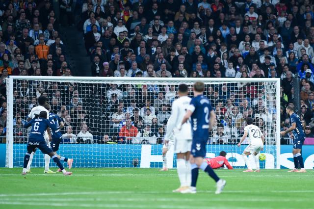 (251208) -- MADRID, Dec. 8, 2025 (Xinhua) -- Real Madrid's goalkeeper Thibaut Courtois (bottom) fail to save the ball during a La Liga football match between Real Madrid and Celta Vigo at Santiago Bernabeu stadium in Madrid, Spain, on Dec. 7, 2025. (Photo by Gustavo Valiente/Xinhua)