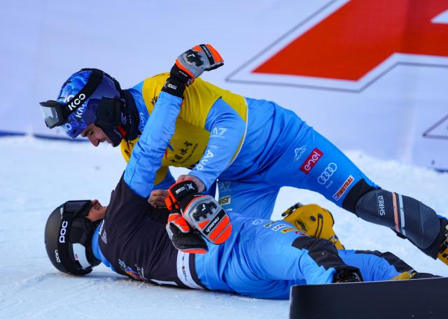 (251208) -- CHIFENG, Dec. 8, 2025 (Xinhua) -- First-placed Mirko Felicetti (bottom) of Italy and third-placed Maurizio Bormolini of Italy celebrate after the men's parallel giant slalom at the FIS Snowboard Alpine World Cup at the Mylin Valley Ski Resort in Chifeng, north China's Inner Mongolia Autonomous Region, on Dec. 7, 2025. (Photo by Kang Wenkui/Xinhua)
