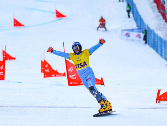 (251208) -- CHIFENG, Dec. 8, 2025 (Xinhua) -- Maurizio Bormolini of Italy celebrates after the small final of the men's parallel giant slalom at the FIS Snowboard Alpine World Cup at the Mylin Valley Ski Resort in Chifeng, north China's Inner Mongolia Autonomous Region, on Dec. 7, 2025. (Photo by Kang Wenkui/Xinhua)