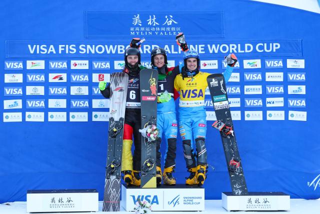 (251208) -- CHIFENG, Dec. 8, 2025 (Xinhua) -- First-placed Mirko Felicetti (C) of Italy, second-placed Stefan Baumeister (L) of Germany and third-placed Maurizio Bormolini of Italy pose during the awarding ceremony of the men's parallel giant slalom at the FIS Snowboard Alpine World Cup at the Mylin Valley Ski Resort in Chifeng, north China's Inner Mongolia Autonomous Region, on Dec. 7, 2025. (Photo by Kang Wenkui/Xinhua)