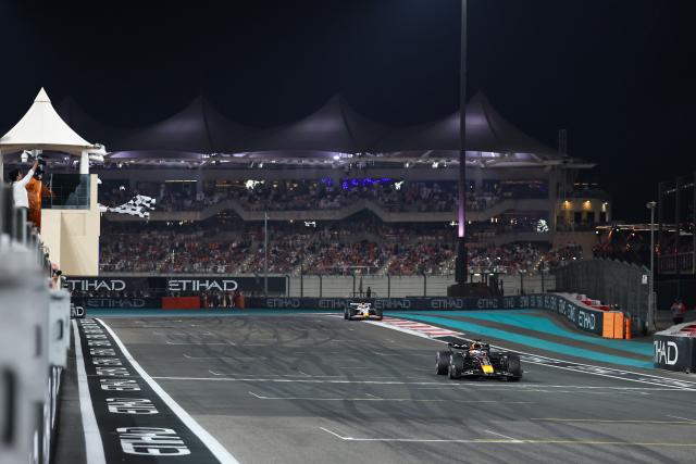 (251208) -- ABU DHABI, Dec. 8, 2025 (Xinhua) -- RedBull's Dutch driver Max Verstappen (front) crosses the finish line during the Formula One Abu Dhabi Grand Prix at the Yas Marina Circuit in Abu Dhabi, the United Arab Emirates, on Dec. 7, 2025. (Photo by Qian Jun/Xinhua)