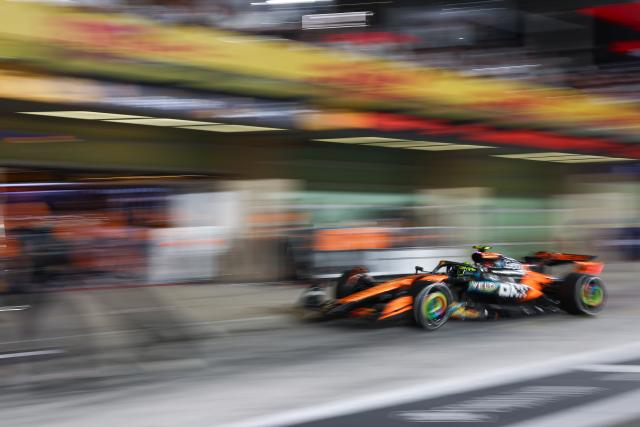 (251208) -- ABU DHABI, Dec. 8, 2025 (Xinhua) -- McLaren's British driver Lando Norris makes his pit stop during the Formula One Abu Dhabi Grand Prix at the Yas Marina Circuit in Abu Dhabi, the United Arab Emirates, on Dec. 7, 2025. (Photo by Qian Jun/Xinhua)