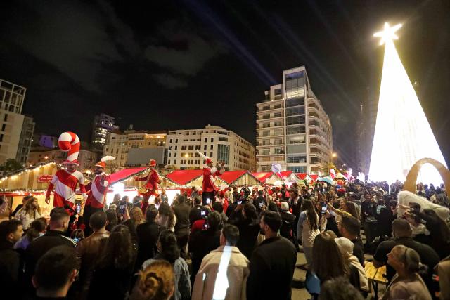 (251208) -- BEIRUT, Dec. 8, 2025 (Xinhua) -- People enjoy the festive atmosphere for the upcoming Christmas at Martyrs' Square in downtown Beirut, Lebanon, Dec. 7, 2025. (Xinhua/Bilal Jawich)