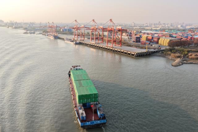 (251208) -- BEIJING, Dec. 8, 2025 (Xinhua) -- An aerial drone photo taken on Dec. 8, 2025 shows a cargo ship sailing into the Yangzhou Port, east China's Jiangsu Province.
  China's foreign trade in goods has sustained strong resilience with steady growth in the first 11 months of 2025 despite external headwinds, official data showed on Monday.
   China's total goods imports and exports in yuan-denominated terms rose to 41.21 trillion yuan (about 5.82 trillion U.S. dollars) in the first 11 months of 2025, up 3.6 percent year on year, according to the General Administration of Customs.
  In November alone, China's goods imports and exports edged up 4.1 percent year on year to 3.9 trillion yuan, the data showed. (Photo by Meng Delong/Xinhua)