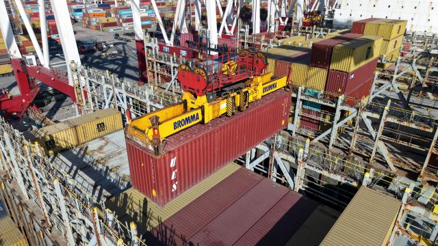 (251208) -- QINGDAO, Dec. 8, 2025 (Xinhua) -- A drone photo taken on Dec. 8, 2025 shows a view of a container terminal at Qingdao Port in Qingdao, east China's Shandong Province. The cargo throughput of Qingdao Port in 2025 surpassed 700 million tonnes on Monday, reaching this milestone 15 days earlier compared to 2024.
   Qingdao Port has continuously expanded its international logistics network, with nearly 240 routes connecting over 700 ports in over 180 countries and regions worldwide. (Xinhua/Li Ziheng)