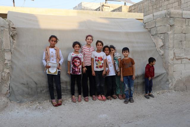 (251208) -- DAMASCUS, Dec. 8, 2025 (Xinhua) -- Children are seen at Karama refugee camp in Idlib, Syria, Sept. 25, 2025. TO GO WITH "Feature: One year after Syria's war ends, displaced families return to ruins, not homes" (Xinhua)