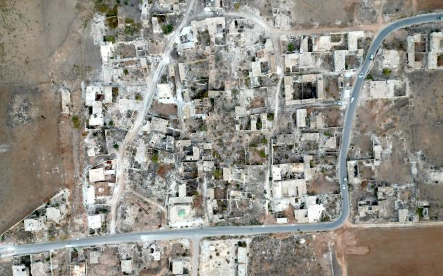 (251208) -- DAMASCUS, Dec. 8, 2025 (Xinhua) -- This aerial drone photo taken on Dec. 4, 2025 shows damaged houses in Ain Daqneh, in the northern countryside of Aleppo, Syria. TO GO WITH "Feature: One year after Syria's war ends, displaced families return to ruins, not homes" (Xinhua)