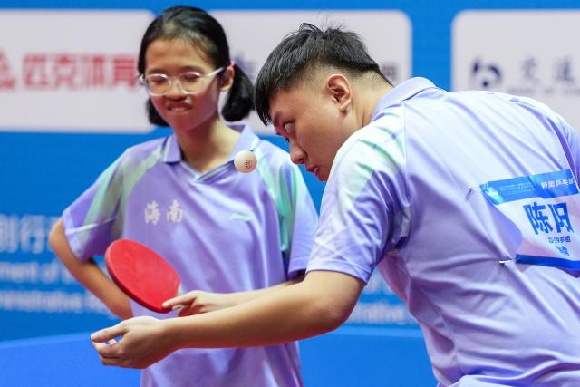 (251208) -- HONG KONG, Dec. 8, 2025 (Xinhua) -- Chen Yang (R)/Meng Zhongxian of Hainan compete during the mixed doubles age 22-29 group A match of special olympics table tennis at China's 12th National Games for Persons with Disabilities and the 9th National Special Olympic Games in Hong Kong, south China, Dec. 8, 2025. (Xinhua/Zhu Zheng)
