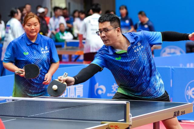 (251208) -- HONG KONG, Dec. 8, 2025 (Xinhua) -- Zhang Liangzhong (R)/Xia Jinglan of Jiangsu compete during the mixed doubles age 30+ group A match of special olympics table tennis at China's 12th National Games for Persons with Disabilities and the 9th National Special Olympic Games in Hong Kong, south China, Dec. 8, 2025. (Xinhua/Zhu Zheng)