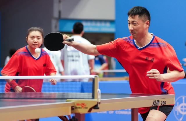 (251208) -- HONG KONG, Dec. 8, 2025 (Xinhua) -- Wang Wei (R)/Zhang Xinyue of Xinjiang compete during the mixed doubles age 30+ group A match of special olympics table tennis at China's 12th National Games for Persons with Disabilities and the 9th National Special Olympic Games in Hong Kong, south China, Dec. 8, 2025. (Xinhua/Zhu Zheng)