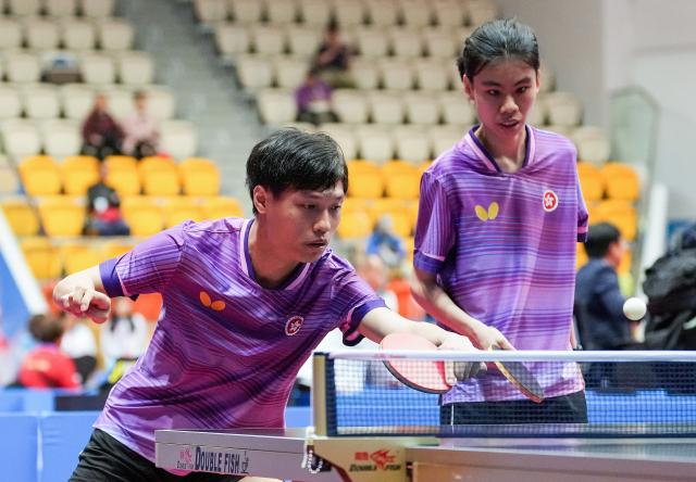 (251208) -- HONG KONG, Dec. 8, 2025 (Xinhua) -- Fan Ka Leung (L)/Cheng Hoi Ching of Hong Kong compete during the mixed doubles age 22-29 group A match of special olympics table tennis at China's 12th National Games for Persons with Disabilities and the 9th National Special Olympic Games in Hong Kong, south China, Dec. 8, 2025. (Xinhua/Zhu Zheng)