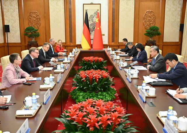 (251208) -- BEIJING, Dec. 8, 2025 (Xinhua) -- Chinese Foreign Minister Wang Yi, also a member of the Political Bureau of the Communist Party of China Central Committee, holds talks with German Foreign Minister Johann Wadephul in Beijing, capital of China, Dec. 8, 2025. (Xinhua/Dai Tianfang)