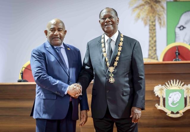 (251208) -- ABIDJAN, Dec. 8, 2025 (Xinhua) -- Cote d'Ivoire's incumbent President Alassane Ouattara (R) attends the inauguration ceremony together with Comorian President Azali Assoumani in Abidjan, economic capital of Cote d'Ivoire, Dec. 8, 2025. Alassane Ouattara, incumbent President of Cote d'Ivoire, was sworn in before the Constitutional Council on Monday, for a fourth five-year term, after winning the election with 89.77 percent of the votes. (Photo by Yvan Sonh/Xinhua)