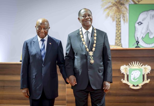 (251208) -- ABIDJAN, Dec. 8, 2025 (Xinhua) -- Cote d'Ivoire's incumbent President Alassane Ouattara (R) attends the inauguration ceremony together with Liberian President Joseph Nyumah Boakai in Abidjan, economic capital of Cote d'Ivoire, Dec. 8, 2025. Alassane Ouattara, incumbent President of Cote d'Ivoire, was sworn in before the Constitutional Council on Monday, for a fourth five-year term, after winning the election with 89.77 percent of the votes. (Photo by Yvan Sonh/Xinhua)