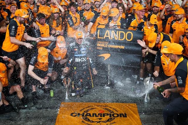 (251209) -- BEIJING, Dec. 9, 2025 (Xinhua) -- McLaren's Lando Norris celebrates with his team after the Formula One Abu Dhabi Grand Prix at the Yas Marina Circuit in Abu Dhabi, the United Arab Emirates, on Dec. 7, 2025. (Xinhua)