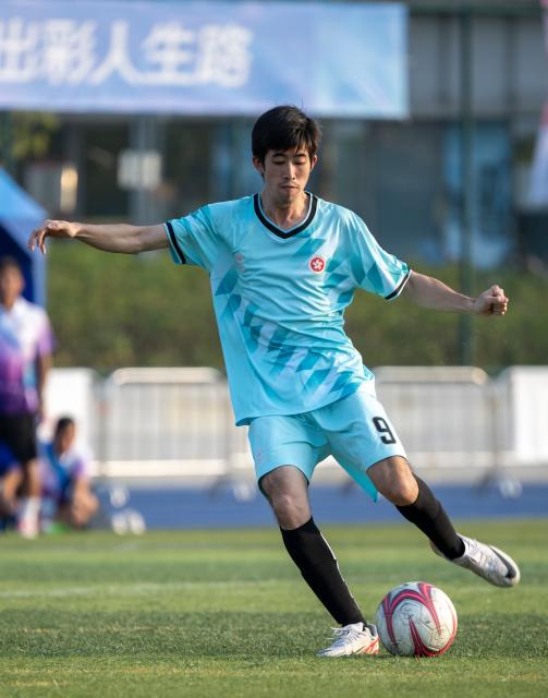 (251209) -- JIANGMEN, Dec. 9, 2025 (Xinhua) -- Chan Ka Wing of Hong Kong shoots during a special olympics football match between Hong Kong and Hubei at China's 12th National Games for Persons with Disabilities and the 9th National Special Olympic Games in Jiangmen, south China's Guangdong Province, Dec. 9, 2025. (Xinhua/Sui Shangjun)