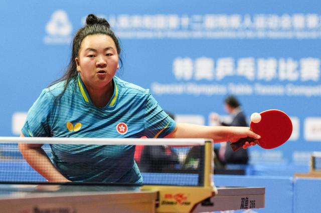(251209) -- HONG KONG, Dec. 9, 2025 (Xinhua) -- Lau Ching Yi of Hong Kong competes during the women's singles age 22-29 group A match of special olympics table tennis at China's 12th National Games for Persons with Disabilities and the 9th National Special Olympic Games in Hong Kong, south China, Dec. 9, 2025. (Xinhua/Zhu Zheng)