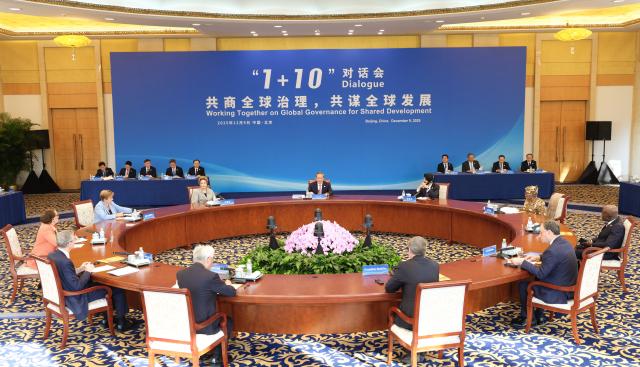 (251209) -- BEIJING, Dec. 9, 2025 (Xinhua) -- Chinese Premier Li Qiang holds the "1+10" Dialogue with heads of major international economic organizations at the Diaoyutai State Guesthouse in Beijing, capital of China, Dec. 9, 2025. The heads of major international economic organizations present at the dialogue were President of the New Development Bank Dilma Rousseff, President of the World Bank Ajay Banga, Managing Director of the International Monetary Fund Kristalina Georgieva, Director-General of the World Trade Organization Ngozi Okonjo-Iweala, Secretary-General of the UN Conference on Trade and Development Rebeca Grynspan, Director-General of the International Labour Organization Gilbert F. Houngbo, General Manager of the Bank for International Settlements Pablo Hernandez de Cos, Chair of the Financial Stability Board Andrew Bailey, President of the Asian Infrastructure Investment Bank Jin Liqun, and Deputy Secretary-General of the Organization for Economic Co-operation and Development Frantisek Ruzicka. (Xinhua/Ding Lin)