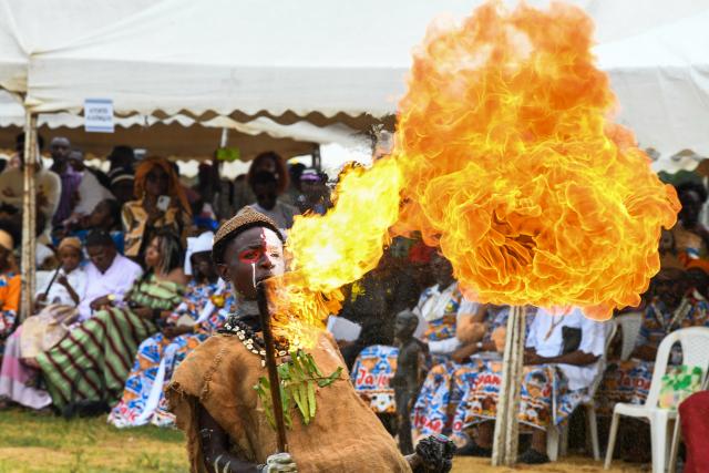 (251209) -- YAOUNDE, Dec. 9, 2025 (Xinhua) -- A performer displays a fire show during the Ngondo Festival in Douala, Cameroon, on Dec. 7, 2025. Thousands recently gathered along the banks of the Wouri River in Cameroon's commercial hub, Douala, to witness the Ngondo Festival, as the Sawa community's iconic river ritual marked its first anniversary as a globally renowned intangible cultural heritage. (Xinhua/Kepseu)