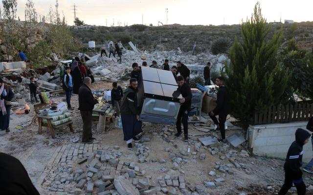 (251209) -- BETHLEHEM, Dec. 9, 2025 (Xinhua) -- Palestinians salvage their belongings after the Israeli forces demolished their house in the town of Husan, west of Bethlehem, in the West Bank, on Dec. 9, 2025. (Photo by Mamoun Wazwaz/Xinhua)