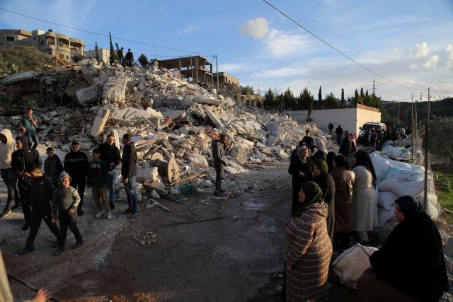 (251209) -- BETHLEHEM, Dec. 9, 2025 (Xinhua) -- Palestinians stand before ruins after the Israeli forces demolished their house in the town of Husan, west of Bethlehem, in the West Bank, on Dec. 9, 2025. (Photo by Mamoun Wazwaz/Xinhua)