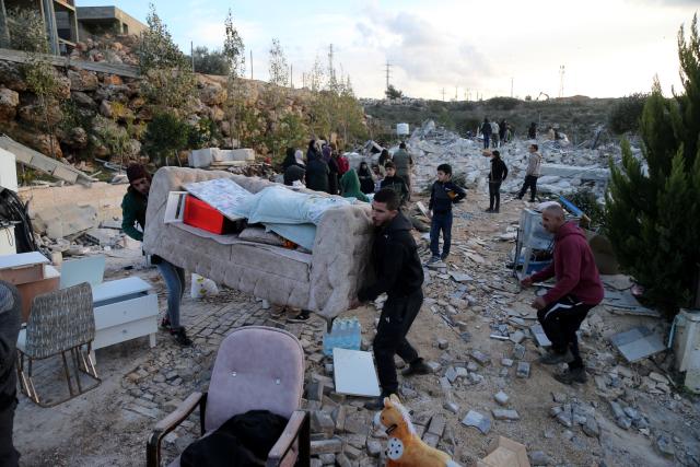 (251209) -- BETHLEHEM, Dec. 9, 2025 (Xinhua) -- Palestinians salvage their belongings after the Israeli forces demolished their house in the town of Husan, west of Bethlehem, in the West Bank, on Dec. 9, 2025. (Photo by Mamoun Wazwaz/Xinhua)