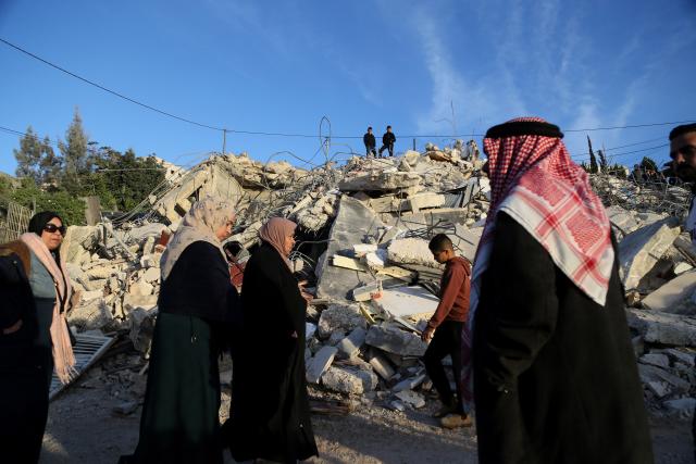 (251209) -- BETHLEHEM, Dec. 9, 2025 (Xinhua) -- Palestinians stand on ruins after the Israeli forces demolished their house in the town of Husan, west of Bethlehem, in the West Bank, on Dec. 9, 2025. (Photo by Mamoun Wazwaz/Xinhua)