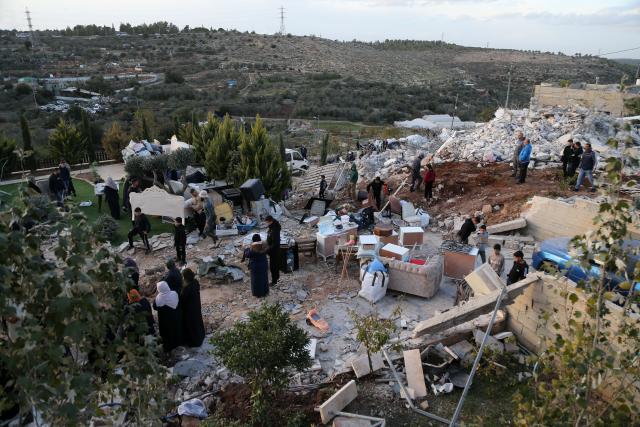 (251209) -- BETHLEHEM, Dec. 9, 2025 (Xinhua) -- Palestinians salvage their belongings after the Israeli forces demolished their house in the town of Husan, west of Bethlehem, in the West Bank, on Dec. 9, 2025. (Photo by Mamoun Wazwaz/Xinhua)
