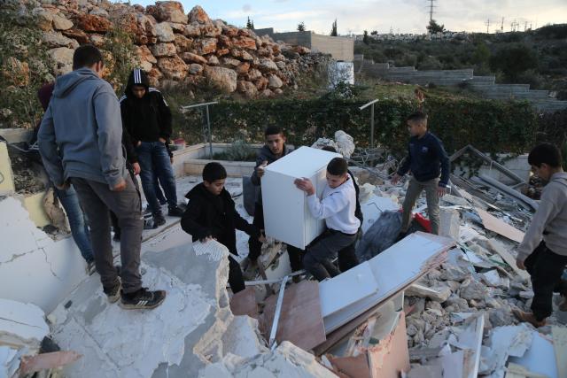 (251209) -- BETHLEHEM, Dec. 9, 2025 (Xinhua) -- Palestinians salvage their belongings after the Israeli forces demolished their house in the town of Husan, west of Bethlehem, in the West Bank, on Dec. 9, 2025. (Photo by Mamoun Wazwaz/Xinhua)