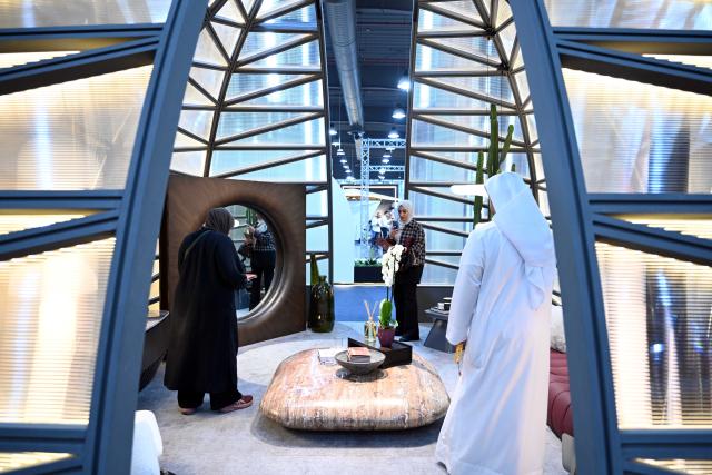 (251209) -- HAWALLI GOVERNORATE, Dec. 9, 2025 (Xinhua) -- People visit the Mirzaam Expo in Hawalli Governorate, Kuwait, on Dec. 9, 2025. The Mirzaam Expo 2025, an interior design and decor exhibition, kicked off here on Tuesday. The expo will last for five days until Dec. 13. (Photo by Asad/Xinhua)