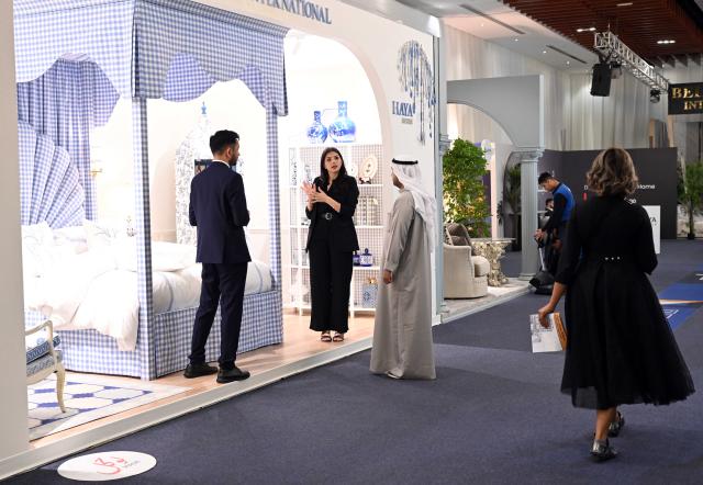 (251209) -- HAWALLI GOVERNORATE, Dec. 9, 2025 (Xinhua) -- People visit the Mirzaam Expo in Hawalli Governorate, Kuwait, on Dec. 9, 2025. The Mirzaam Expo 2025, an interior design and decor exhibition, kicked off here on Tuesday. The expo will last for five days until Dec. 13. (Photo by Asad/Xinhua)