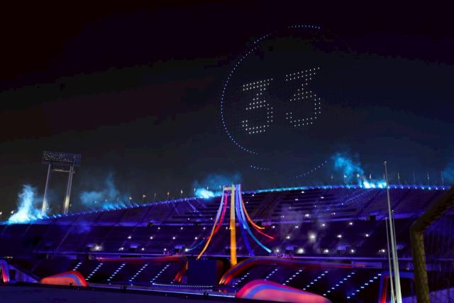 (251210) -- BANGKOK, Dec. 10, 2025 (Xinhua) -- Spectators watch a drone light show during the opening ceremony of the 33rd Southeast Asian Games in Bangkok, Thailand, Dec. 9, 2025. The 33rd Southeast Asian (SEA) Games officially commenced in Bangkok on Tuesday. (Xinhua/Pool)