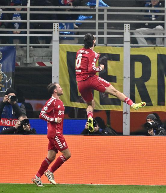 (251210) -- MILAN, Dec. 10, 2025 (Xinhua) -- Liverpool's Dominik Szoboszlai (R) celebrates his goal during the UEFA Champions League between Inter Milan and Liverpool in Milan, Italy, Dec. 9, 2025. (Photo by Alberto Lingria/Xinhua)
