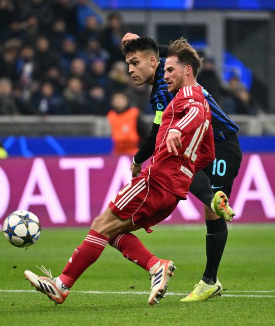 (251210) -- MILAN, Dec. 10, 2025 (Xinhua) -- Inter Milan's Lautaro Martinez (R) vies with Liverpool's Alexis Mac Allister during the UEFA Champions League between Inter Milan and Liverpool in Milan, Italy, Dec. 9, 2025. (Photo by Alberto Lingria/Xinhua)