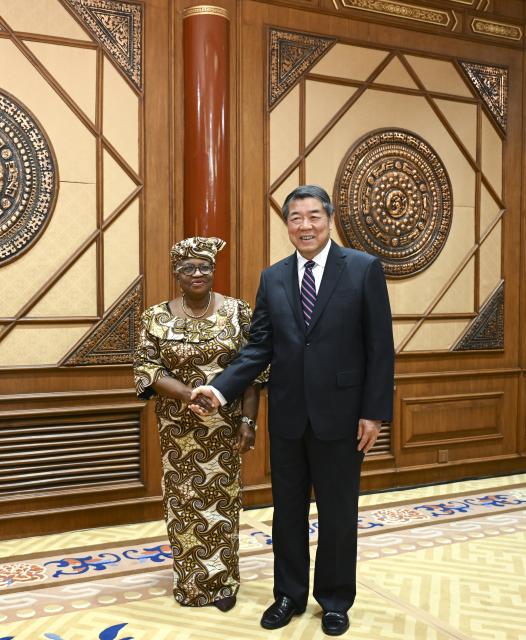 (251210) -- BEIJING, Dec. 10, 2025 (Xinhua) -- Chinese Vice Premier He Lifeng, also a member of the Political Bureau of the Communist Party of China Central Committee, meets with Director-General of the World Trade Organization (WTO) Ngozi Okonjo-Iweala in Beijing, capital of China, Dec. 9, 2025. (Xinhua/Zhang Ling)